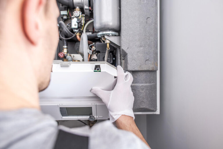 Technician evaluating a residential water heater