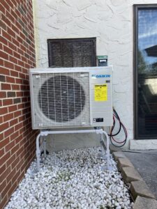 Daikin FIT outdoor heat pump on a raised metal stand during installation in Mechanicsburg, PA.