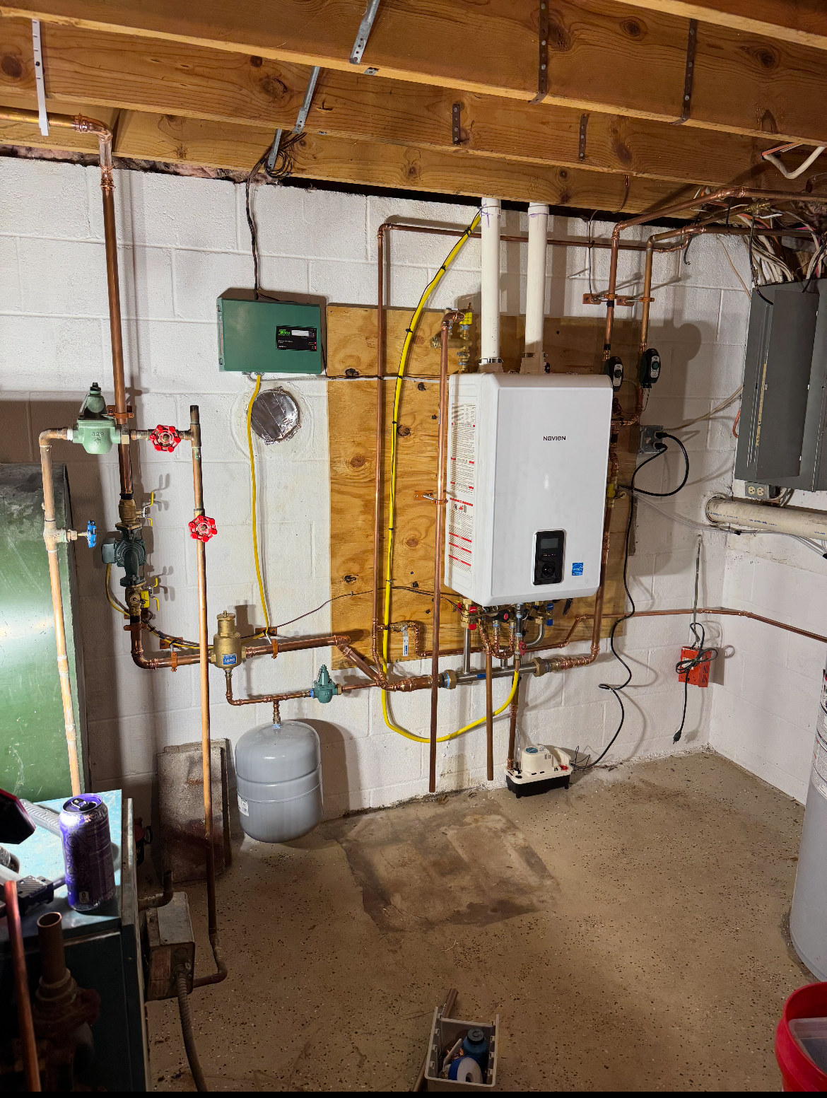 Navien Tankless Water Heater Installation: 10 Questions Before You Buy 1 Navien combi-boiler installation completed by Metro HVAC, shown with its connected piping