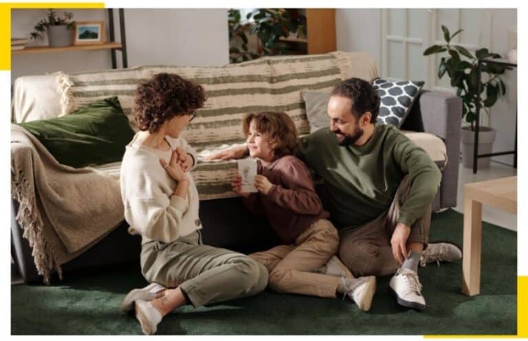 Family sitting in their home looking very comfortable