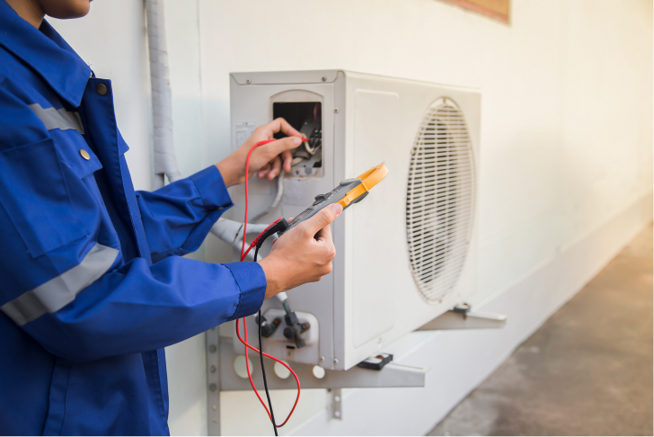 technician checking operation air conditioner 1